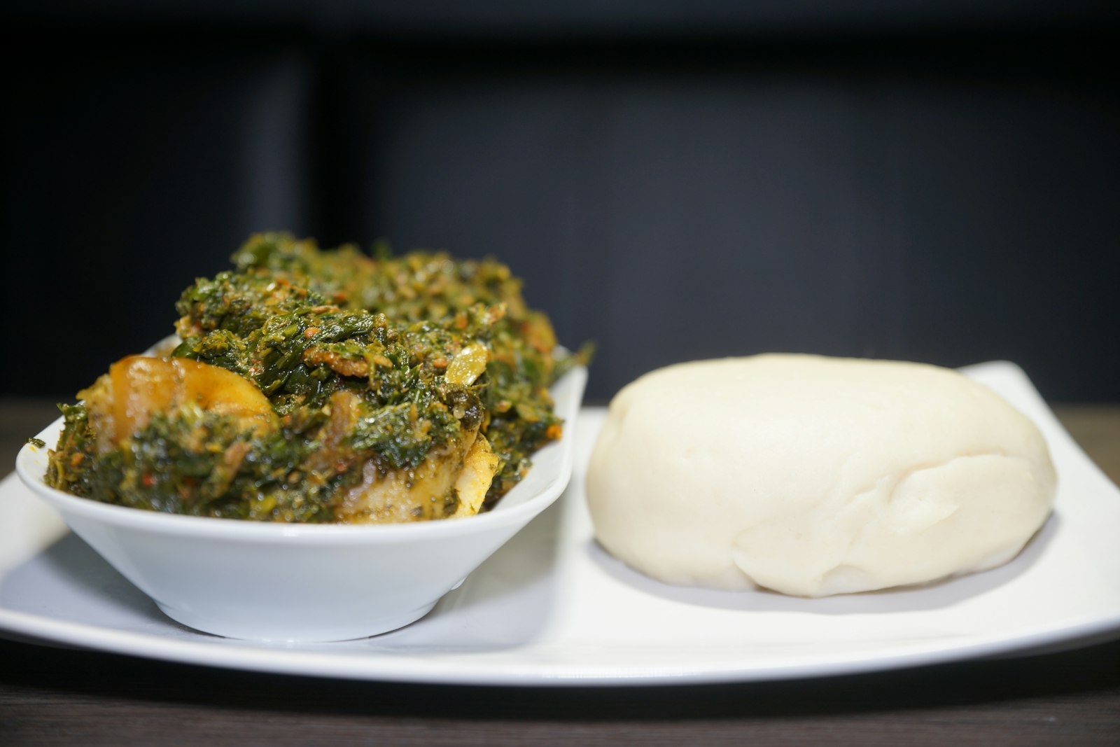 Slow-braised Jamaican stew with greens and dumpling